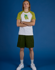 Grant is wearing Produce Raglan Tee in Snap Peas