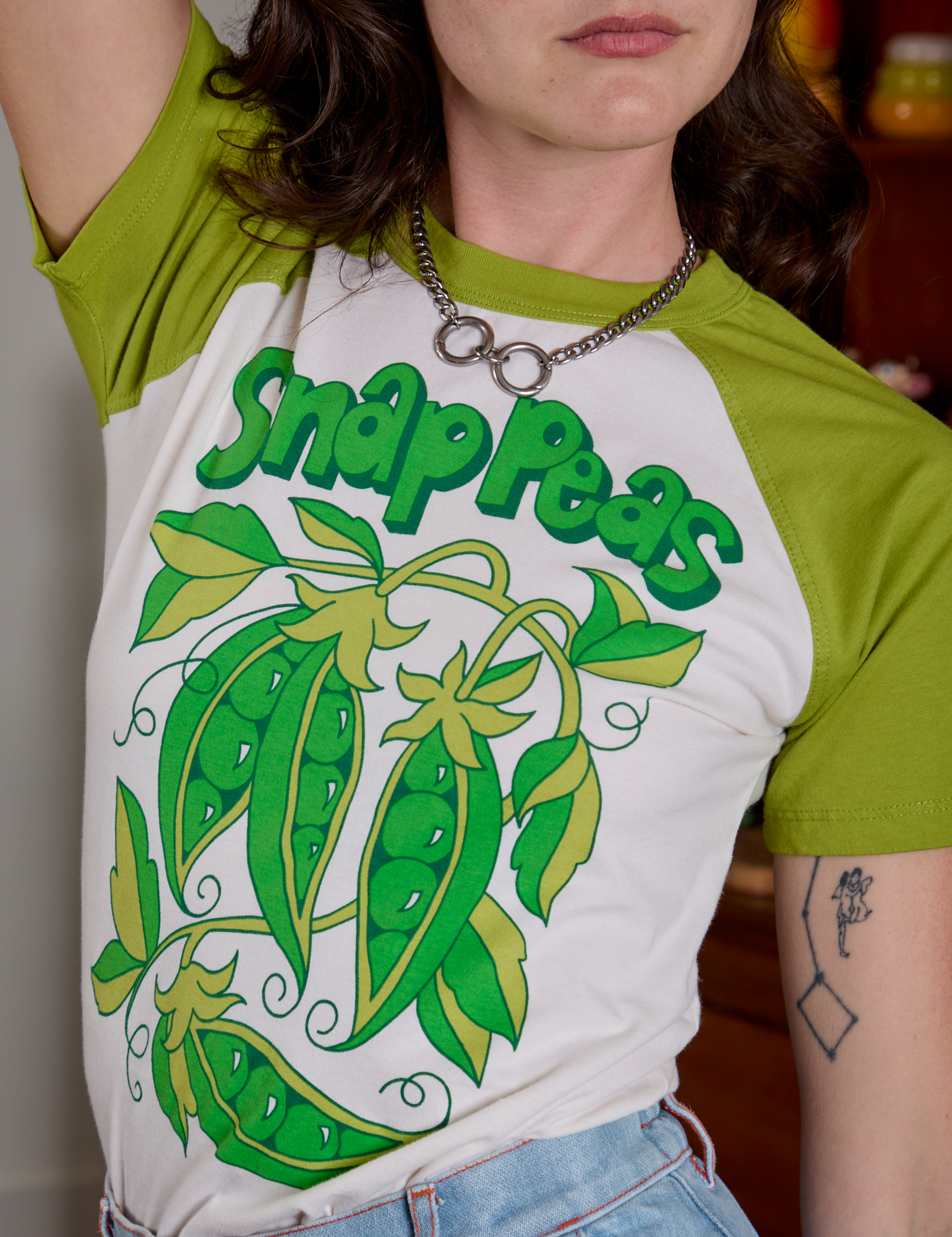 Front close up of Short Sleeve Raglan Tee in Snap Peas on Alex