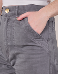 Close up of Hana's hand in the front pocket of Work Pants in Washed Grey