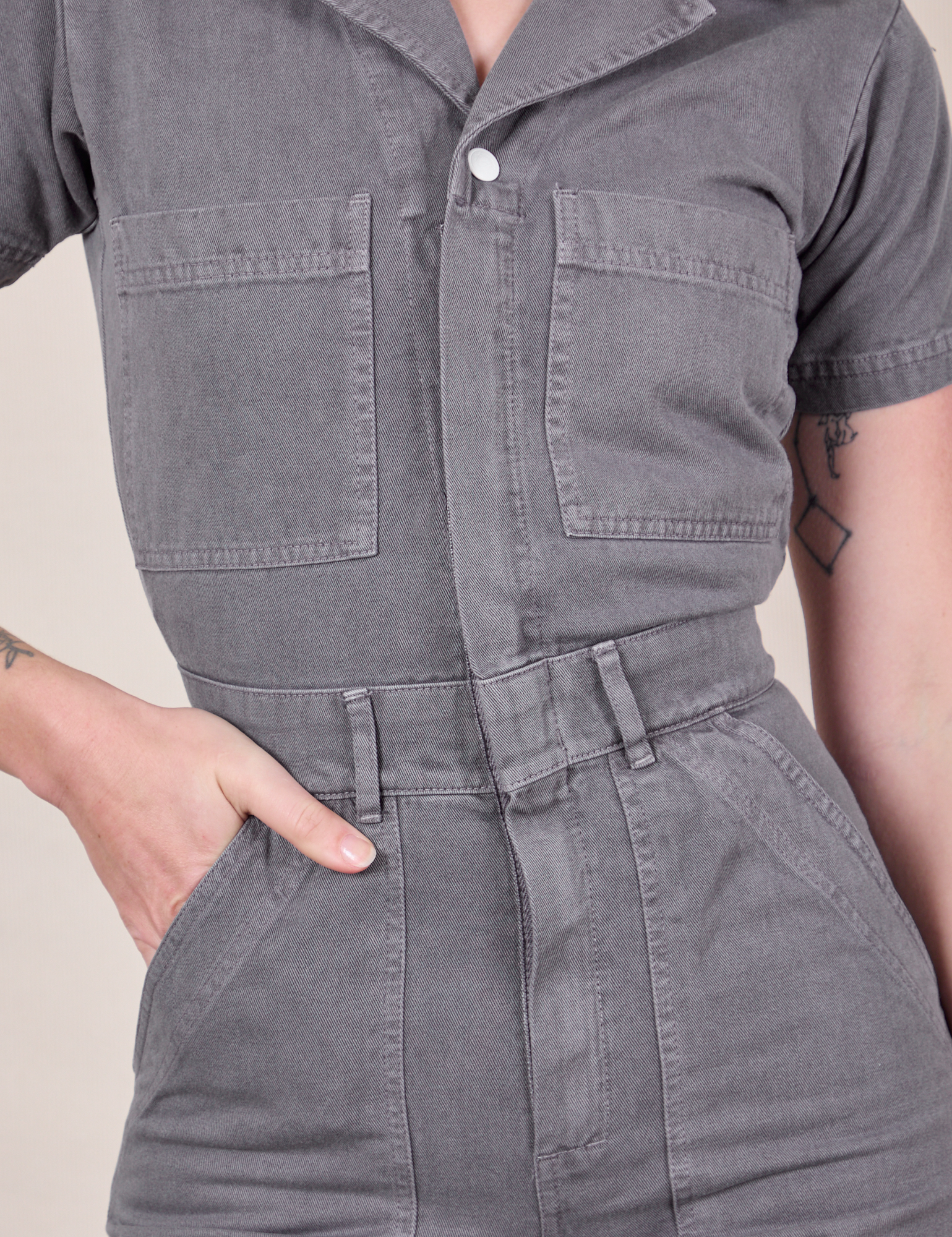 Short Sleeve Jumpsuit in Washed Grey front close up on Alex