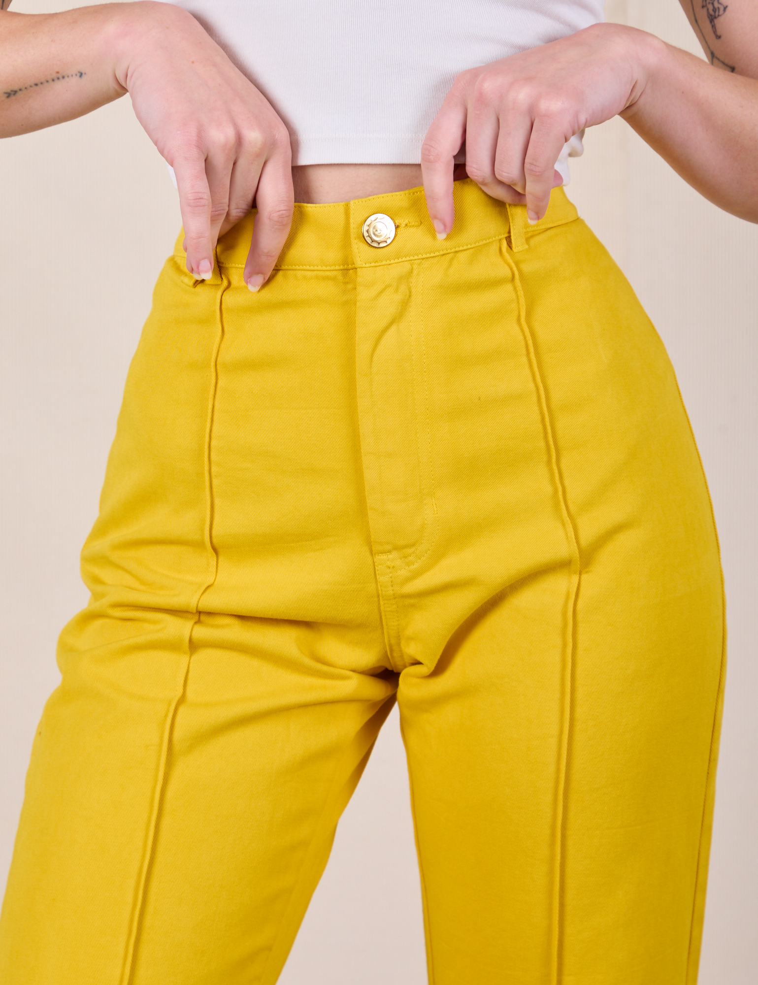 Western Pants in Golden Yellow front close up on Alex