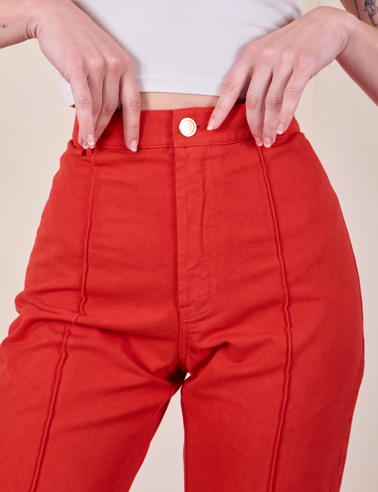 Western Pants in Mustang Red front close up on Alex