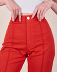 Western Pants in Mustang Red front close up on Alex