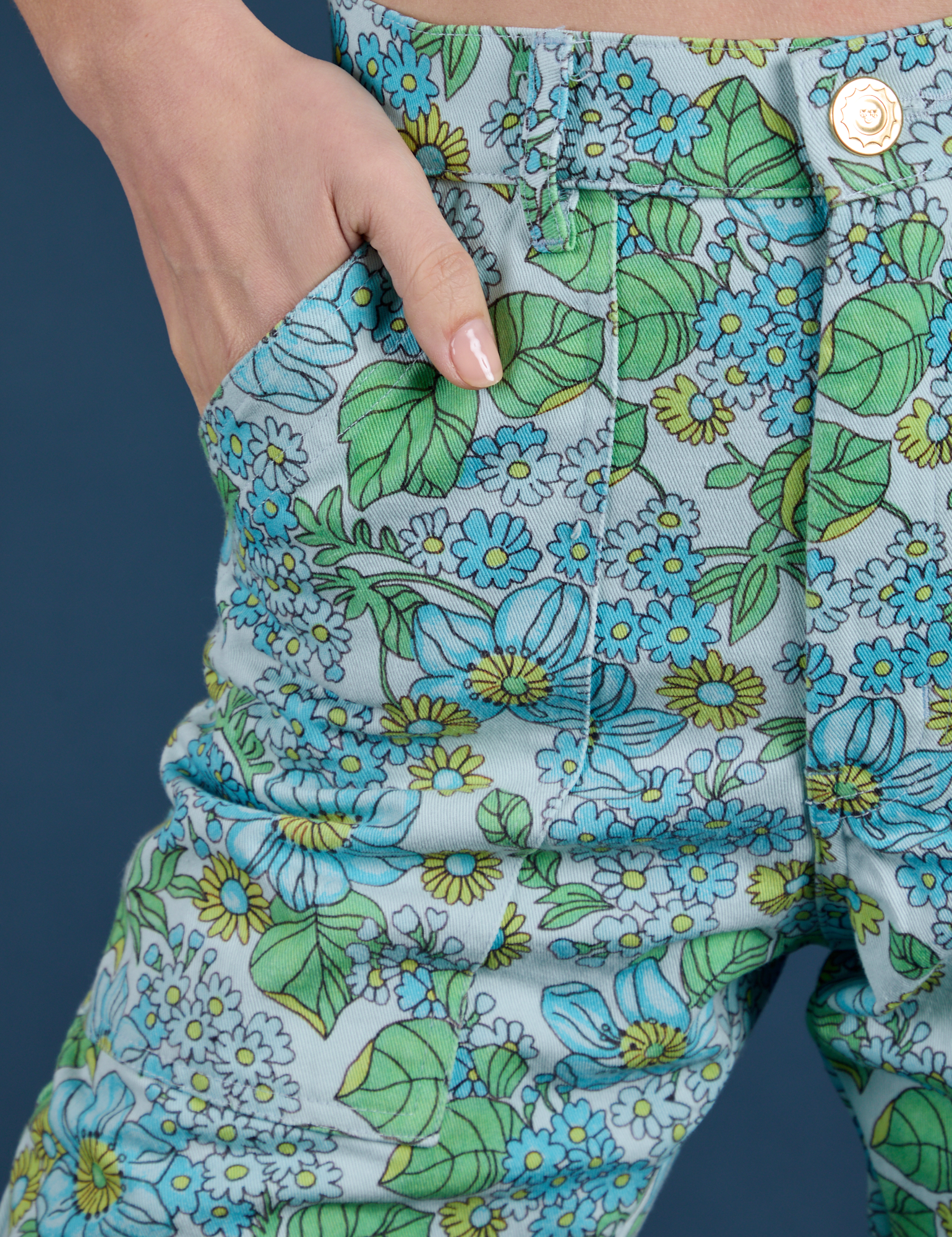Close up of Madeline's hand in the front pocket of Winter Floral Print Work Pants