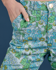 Close up of Madeline's hand in the front pocket of Winter Floral Print Work Pants