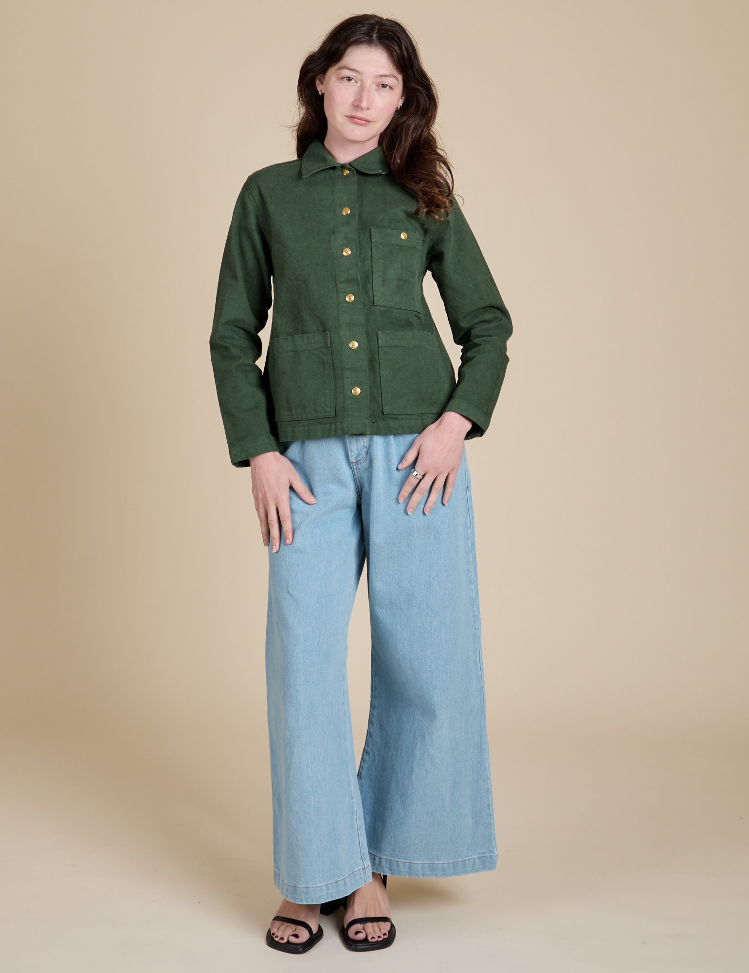 Alex is wearing Denim Work Jacket in Swamp Green and light wash Indigo Wide Leg Trousers