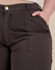 Close up of Ashley's hand in the front pocket of Work Pants in Espresso Brown