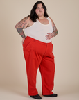 Angled front view of Work Pants in Mustang Red and Cropped Tank in Vintage Tee White on Sam