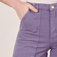 Front pocket close up of Classic Work Shorts in Faded Grape. Alex has her hand in the front pocket.