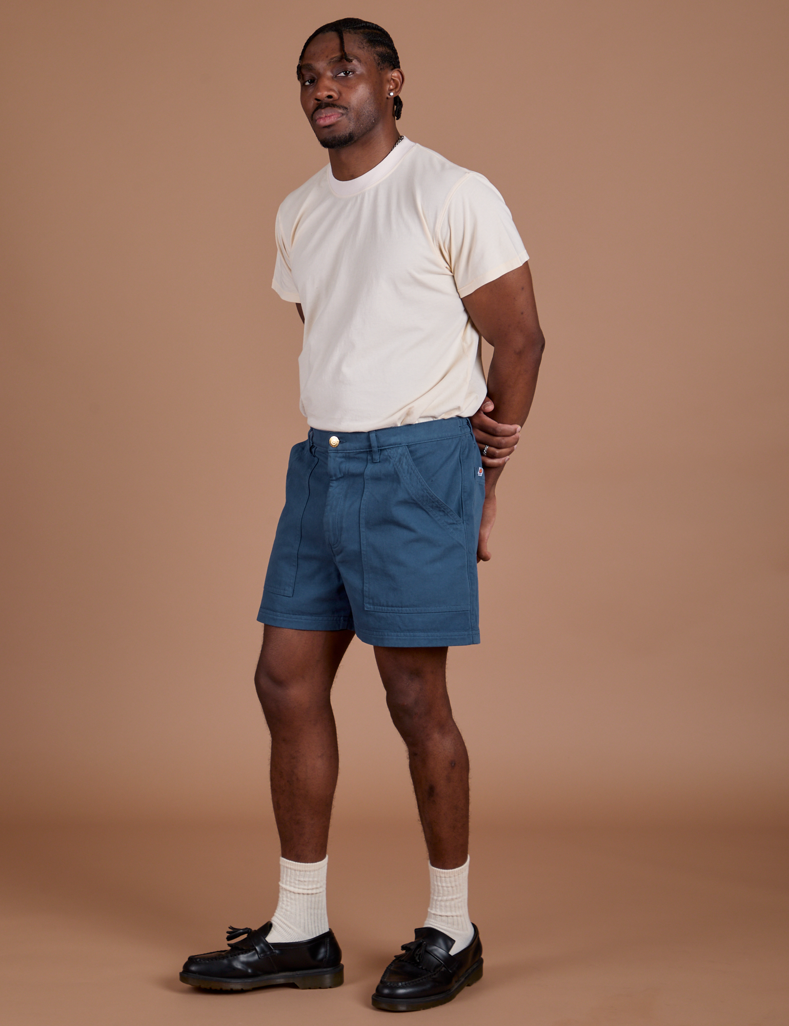 Angled front view of  Classic Work Shorts in French Blue and Organic Vintage Tee in Vintage Off-White