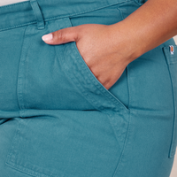 Side close up of Classic Work Shorts in Marine Blue. Morgan has her hand in the front pocket.