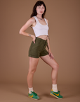 Side view of Classic Work Shorts in Surplus Green and vintage off white Cropped Tank on Alex