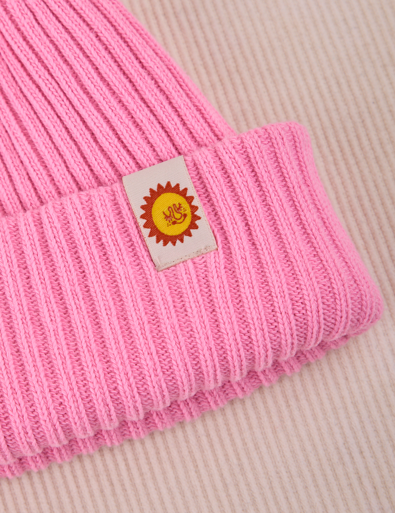 Ribbed Beanie close up with sun baby tab