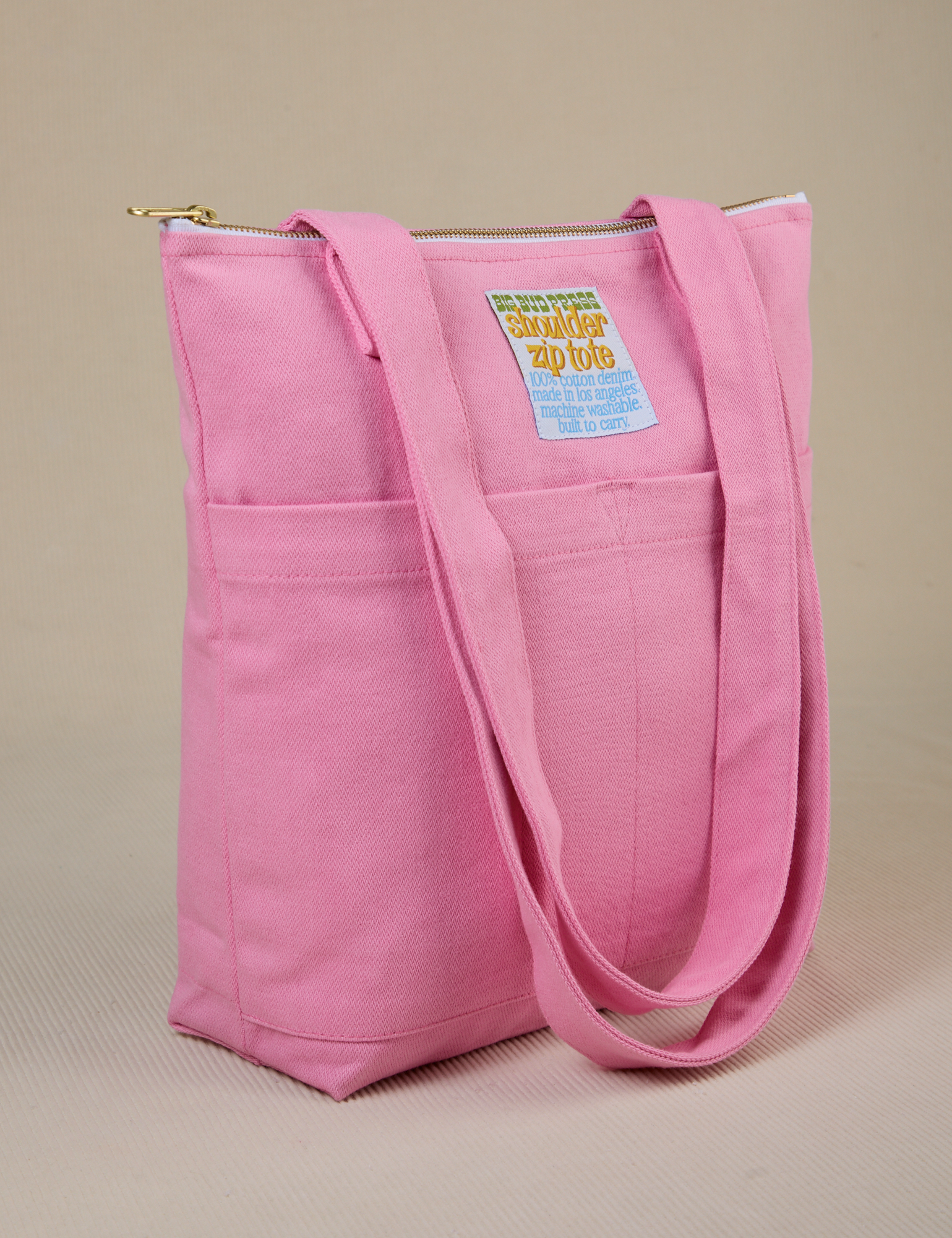 Angled view of Over-Shoulder Zip Mini Tote in Bubblegum Pink