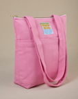 Angled view of Over-Shoulder Zip Mini Tote in Bubblegum Pink