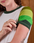 Calypso Tee in Forest sleeve close up on Alex
