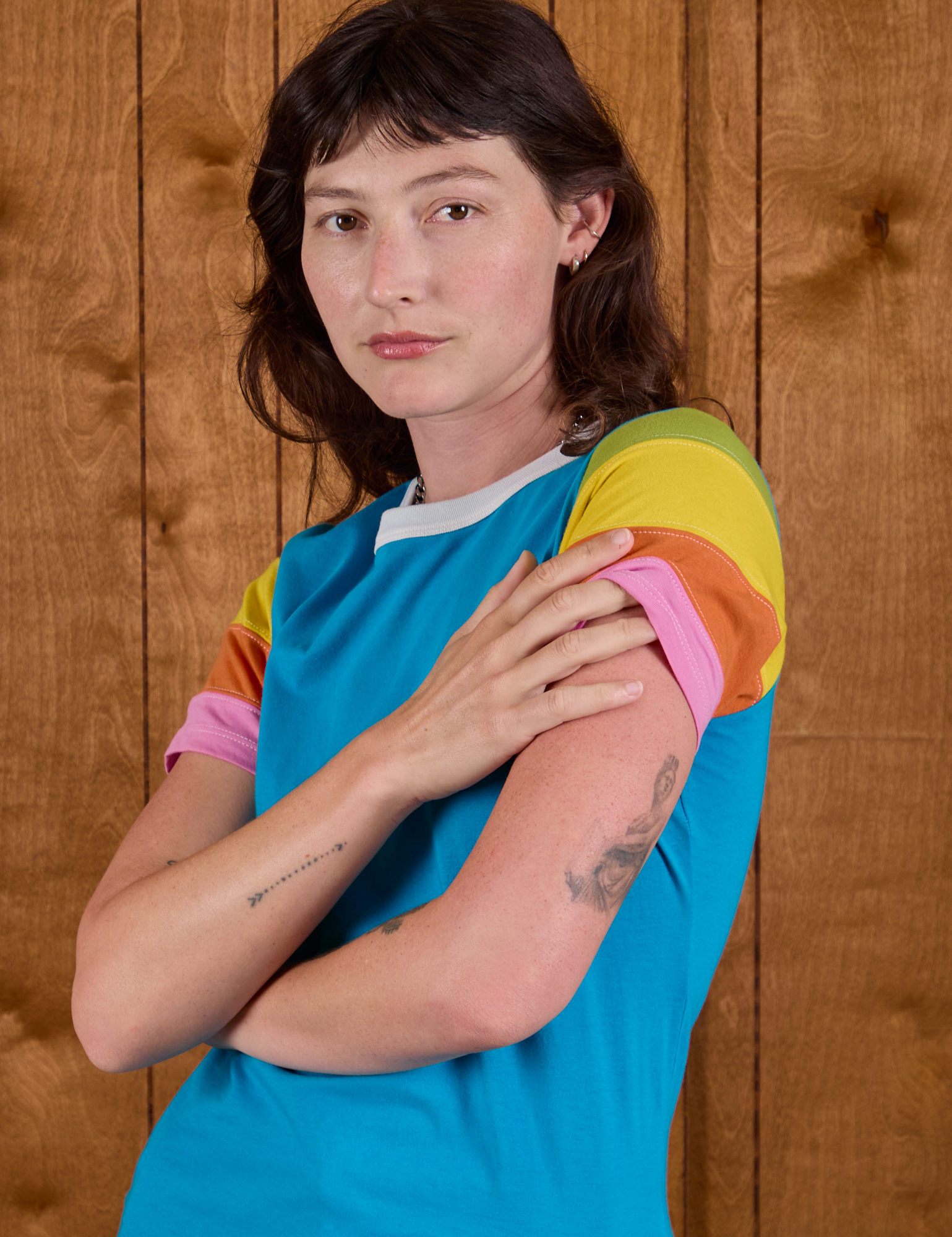 Calypso Tee in Rainbow angled front view on Alex