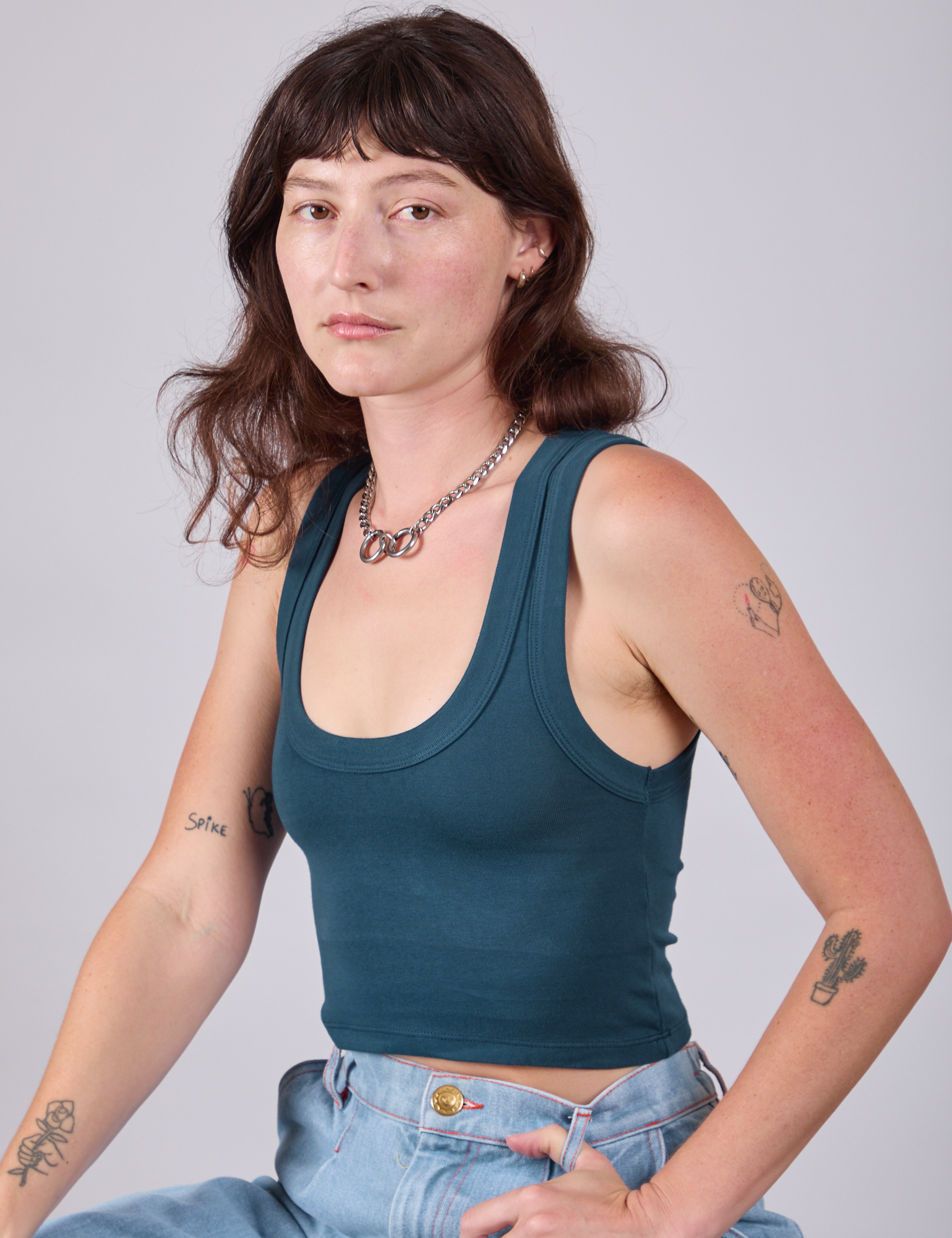 Cropped Tank Top in Lagoon angled front view on Alex