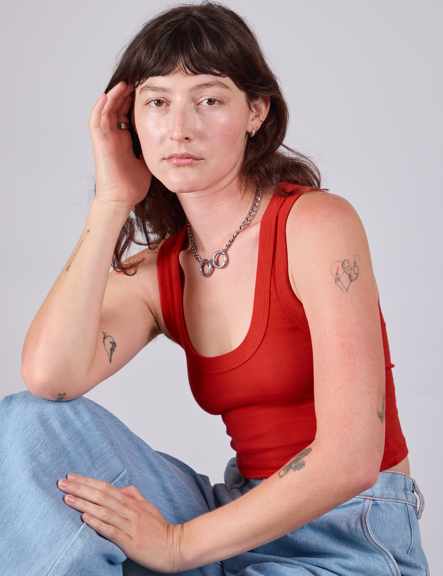 Alex is wearing Cropped Tank Top in Mustang Red