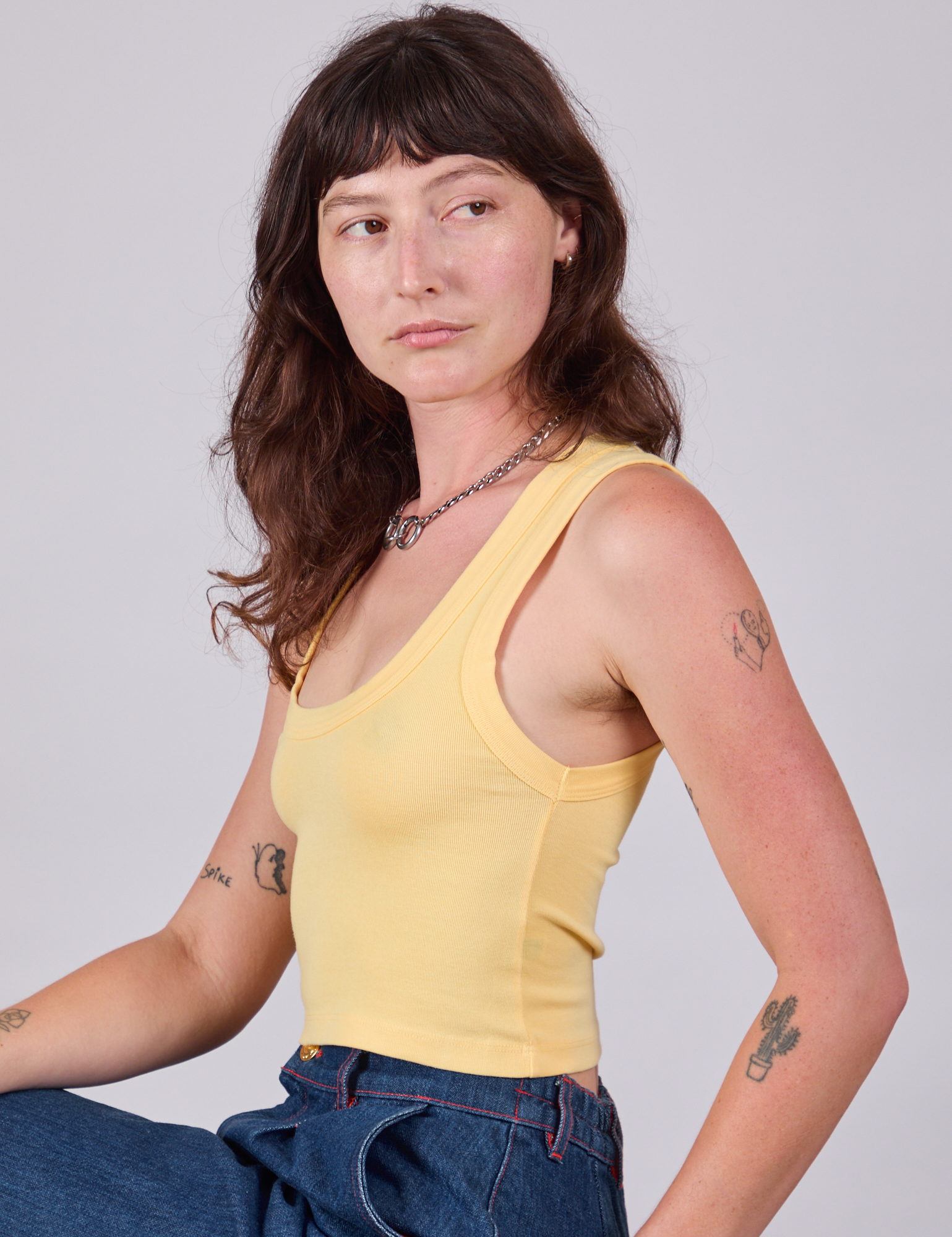 Cropped Tank Top in Butter Yellow side view on Alex