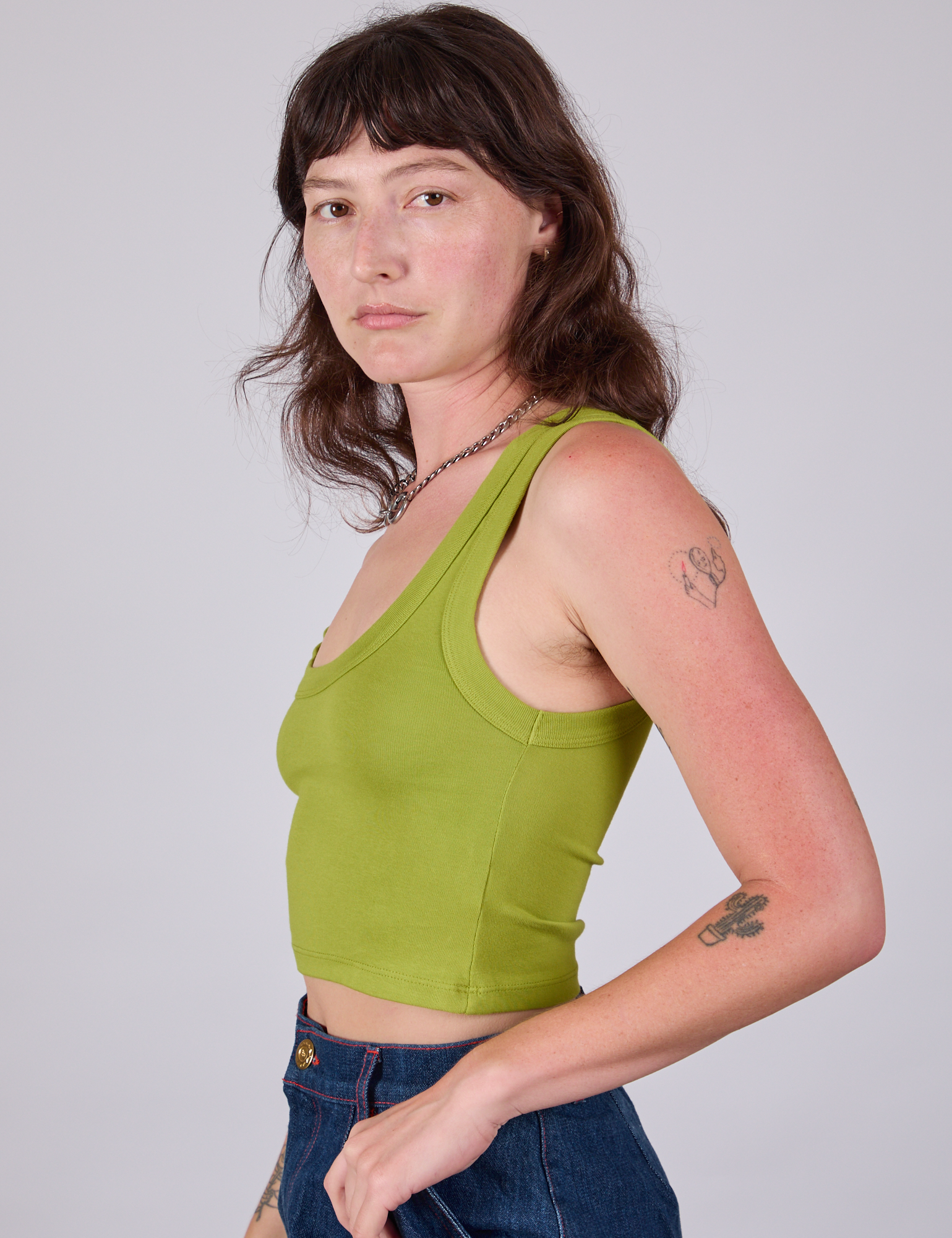 Cropped Tank Top in Gross Green side view on Alex