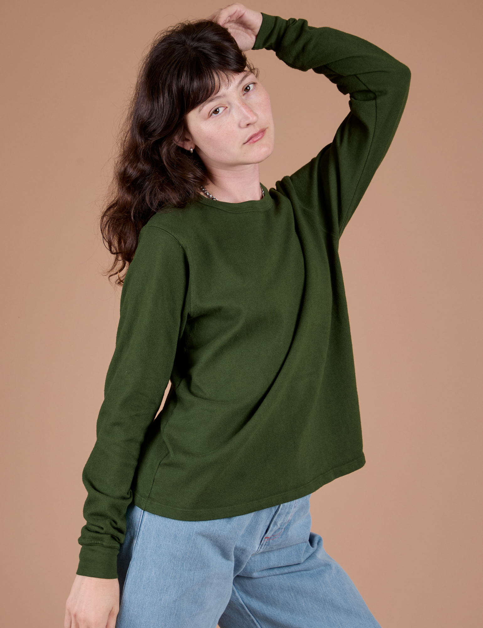 Long Sleeve Burly Tee in Evergreen angled front view on Alex