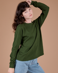 Long Sleeve Burly Tee in Evergreen angled front view on Alex