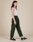 Side view of Heavyweight Trousers in Swamp Green and Cropped Tank in vintage tee white