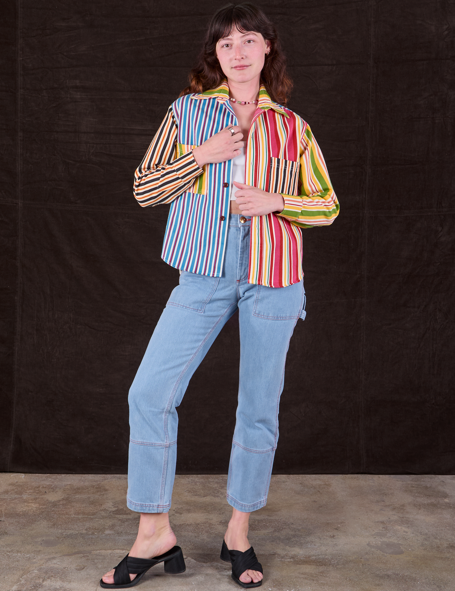 Alex is wearing Cropped Overshirt in Mixed Stripe and light wash Carpenter. Jeans