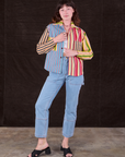 Alex is wearing Cropped Overshirt in Mixed Stripe and light wash Carpenter. Jeans