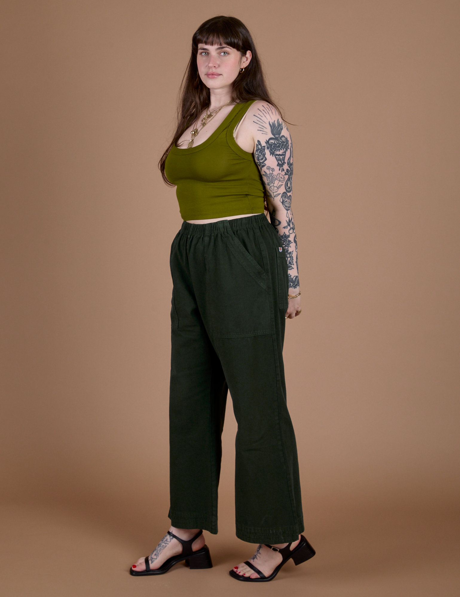 Side view of Action Pants in Swamp Green and olive green Cropped Tank