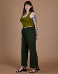 Side view of Action Pants in Swamp Green and olive green Cropped Tank