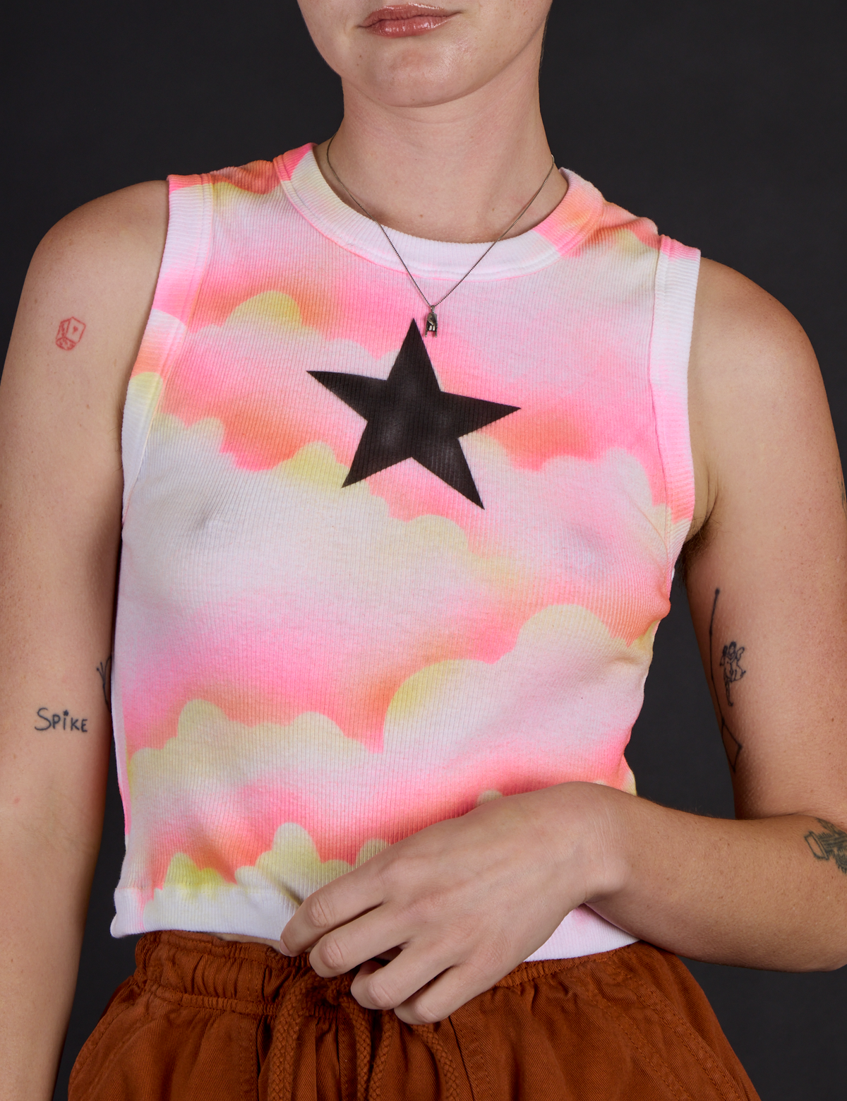 Close up of the Black Star Airbrush Muscle Tee on Alex