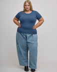 Juliet is wearing Baby Tee in French Blue and light wash denim drop pocket pants