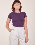 Alex is wearing Baby Tee in Nebula Purple and vintage off-white Trousers