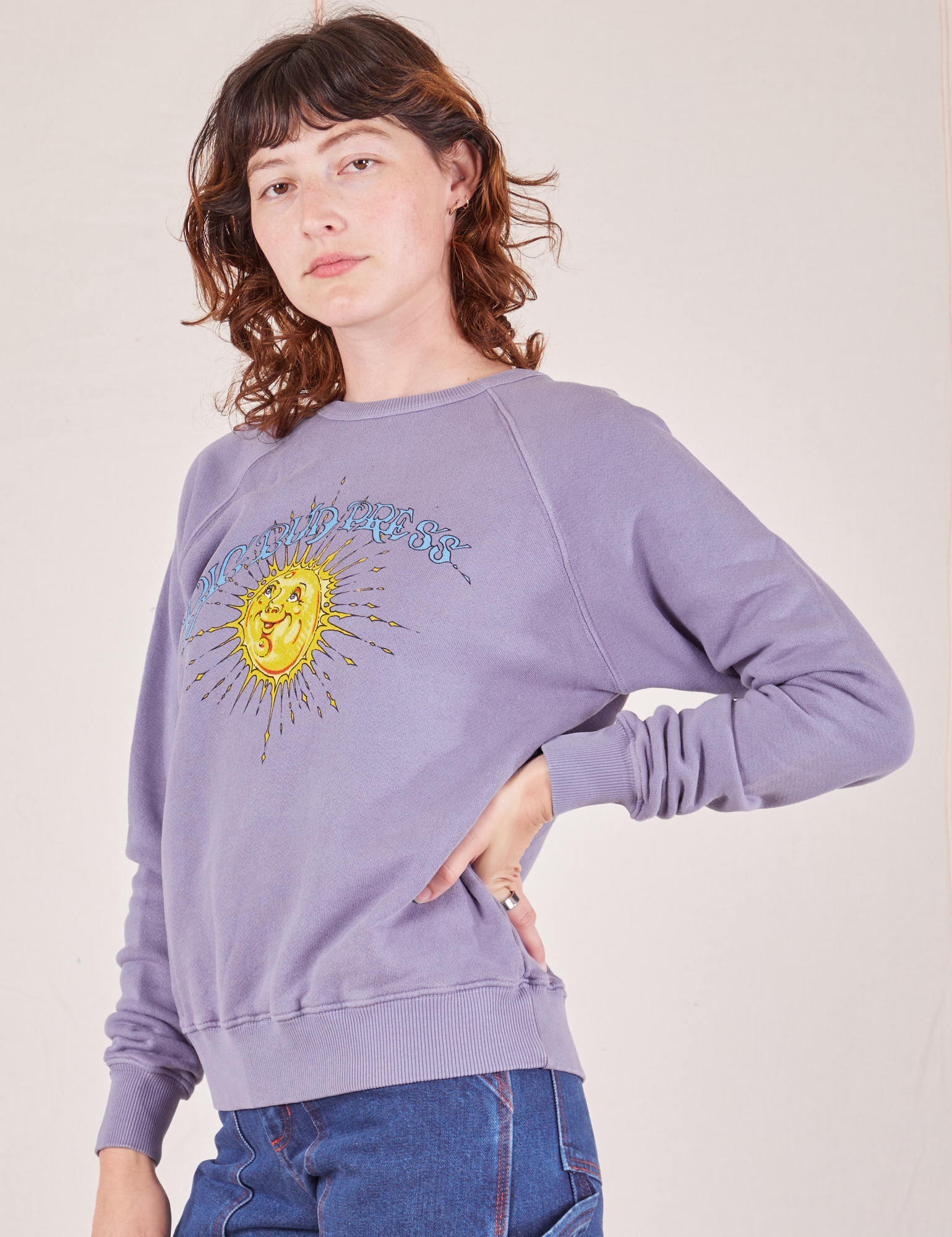 Angled side view of Bill Ogden&#39;s Sun Baby Crew in Faded Grape on Alex