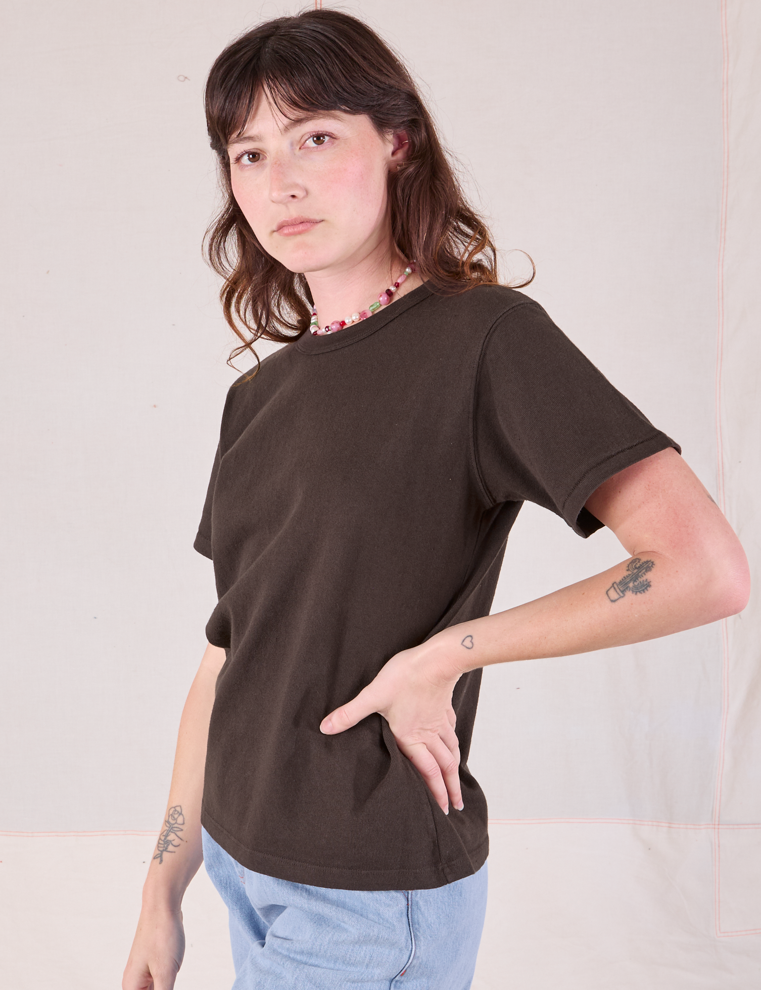 Burly Tee in Espresso Brown angled front view on Alex