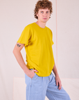 Burly Tee in Golden Yellow side view on Quinn