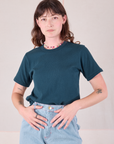 Burly Tee in Lagoon tucked into light wash Denim Wide Leg Trousers on Alex