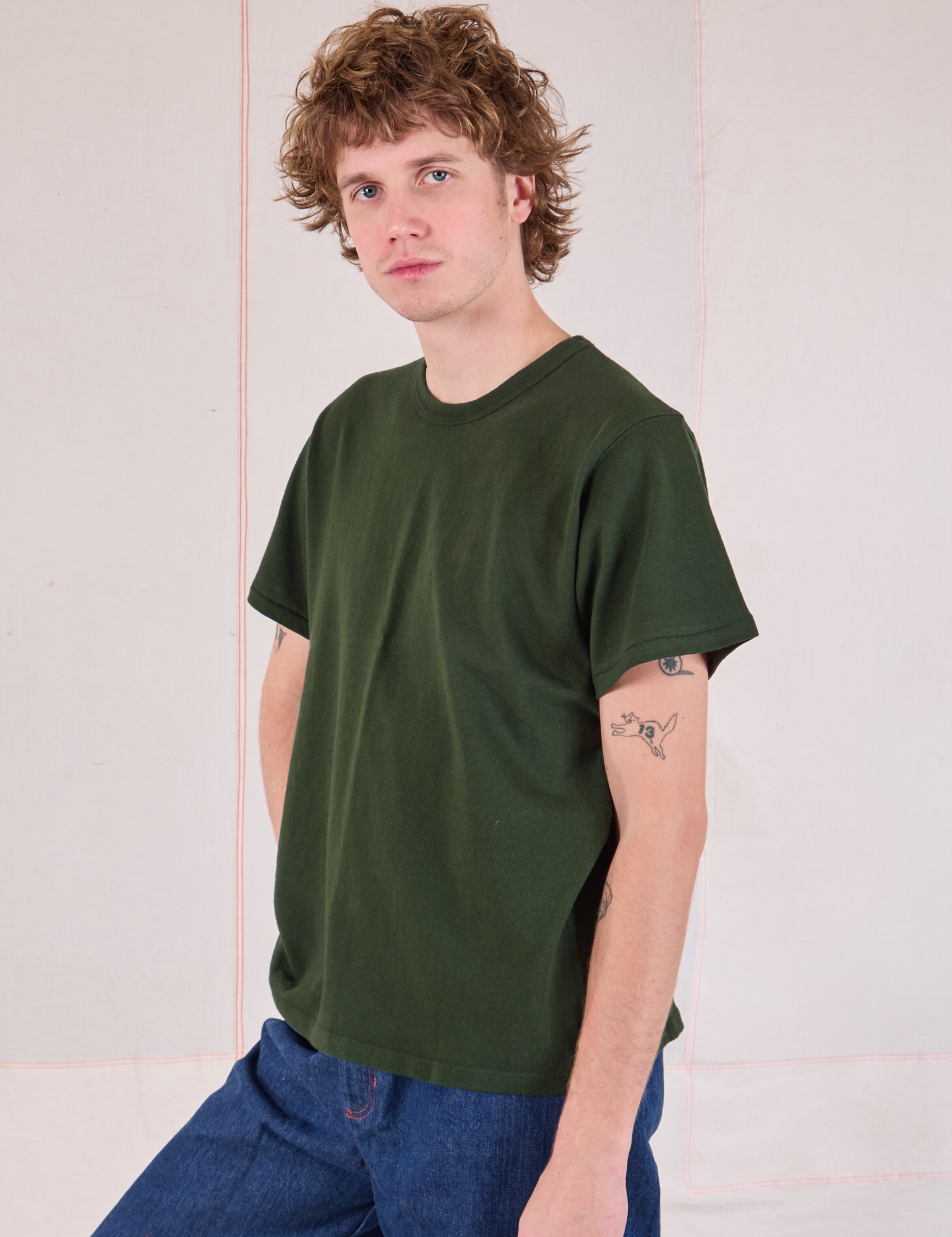 Burly Tee in Swamp Green side view on Quinn