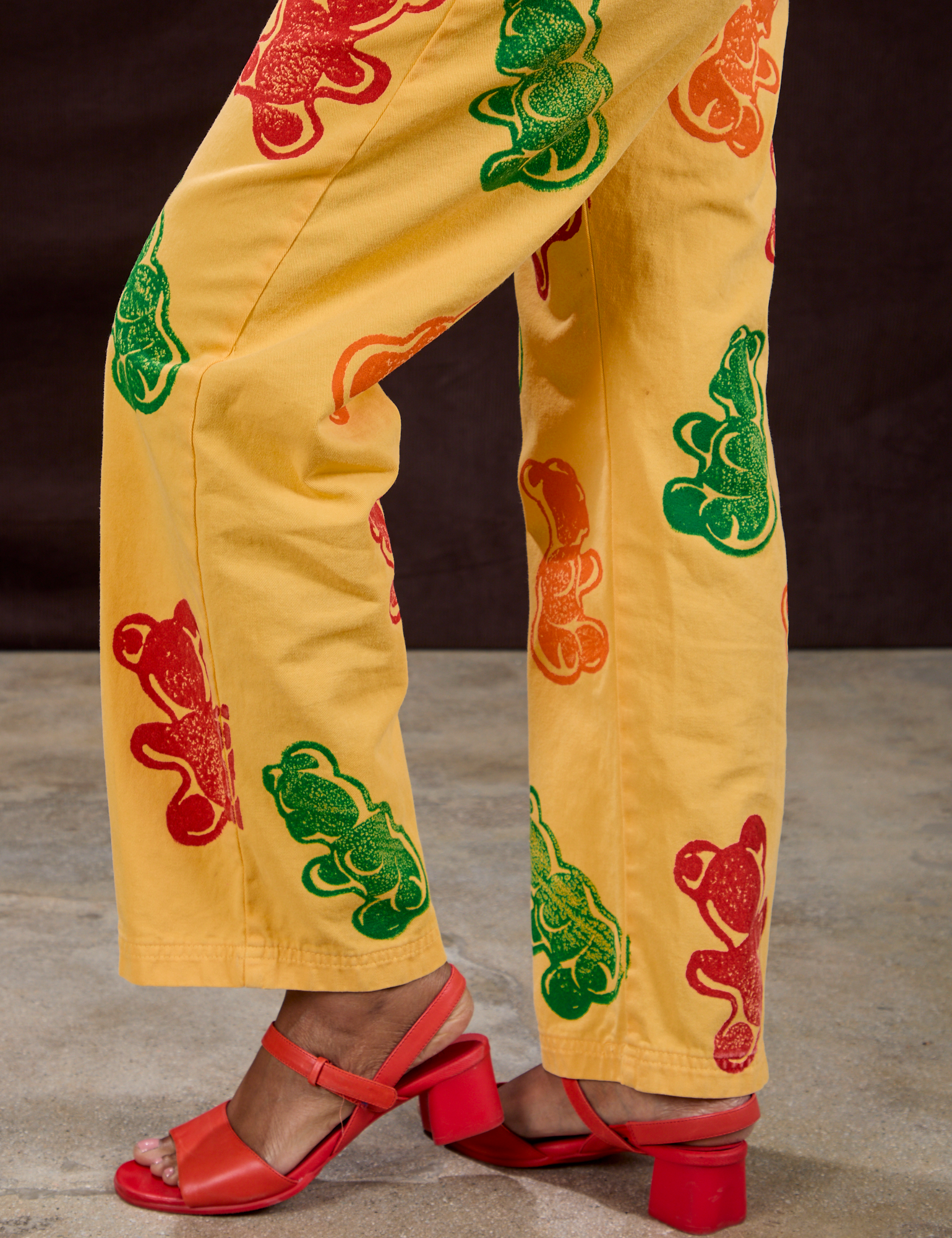 Gummy Bear Paintstamped Work Pants in Butter Yellow pant leg close up on Kandia