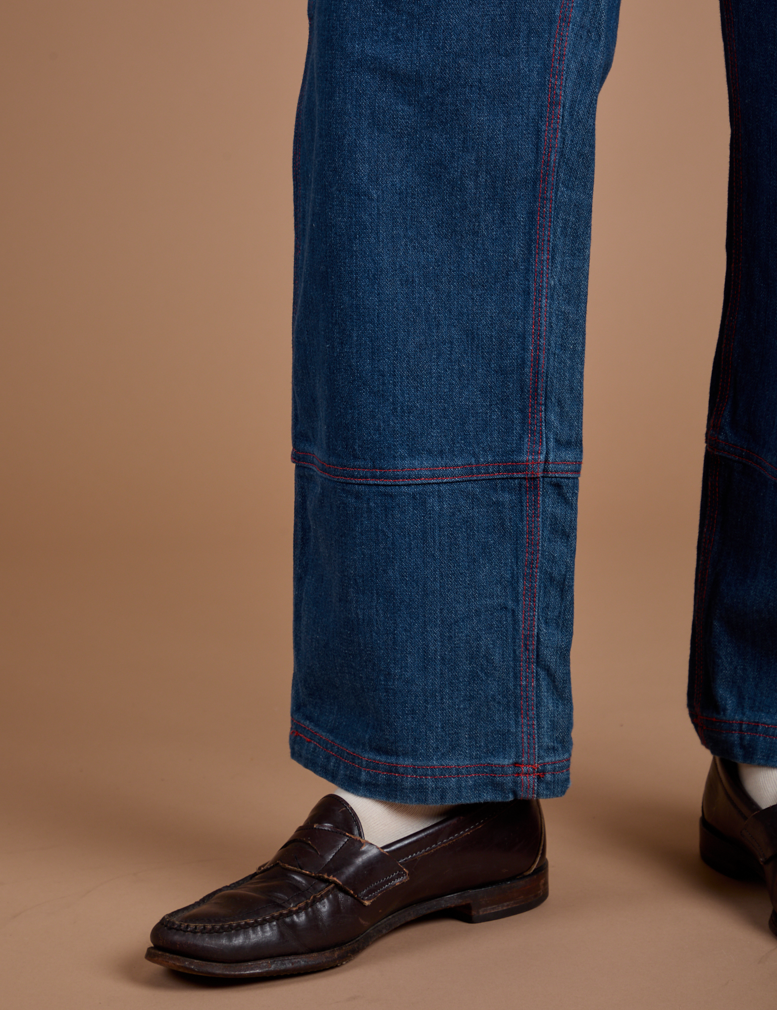 Carpenter Jeans in Dark Wash pant leg close up on Quinn
