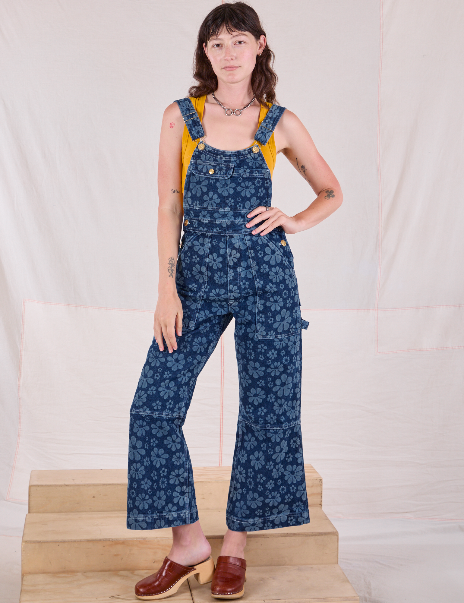 Alex is wearing Carpenter Overalls in Lazy Daisy