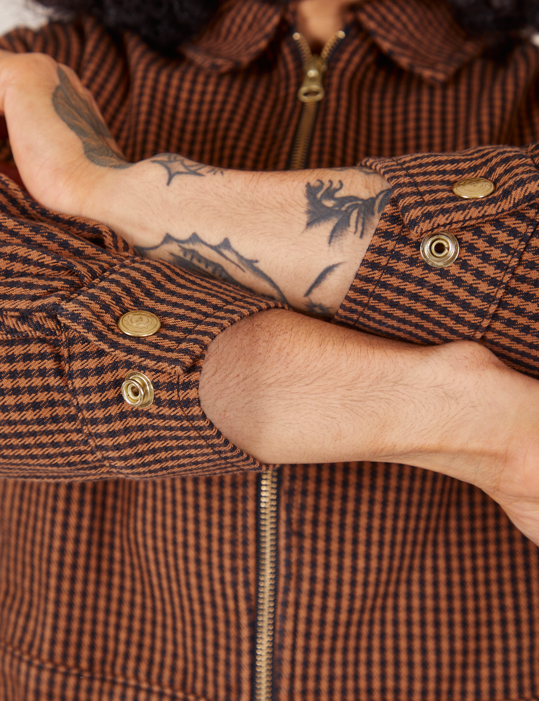 Sleeve cuff close up of Ricky Jacket in Brown Checker worn by Jesse