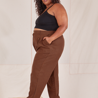 Side view of Checker Trousers in Brown and black Cropped Cami on Morgan