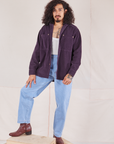 Jesse is wearing Corduroy Overshirt in Nebula Purple with a vintage off-white Cropped Tank underneath and light wash Trouser Jeans