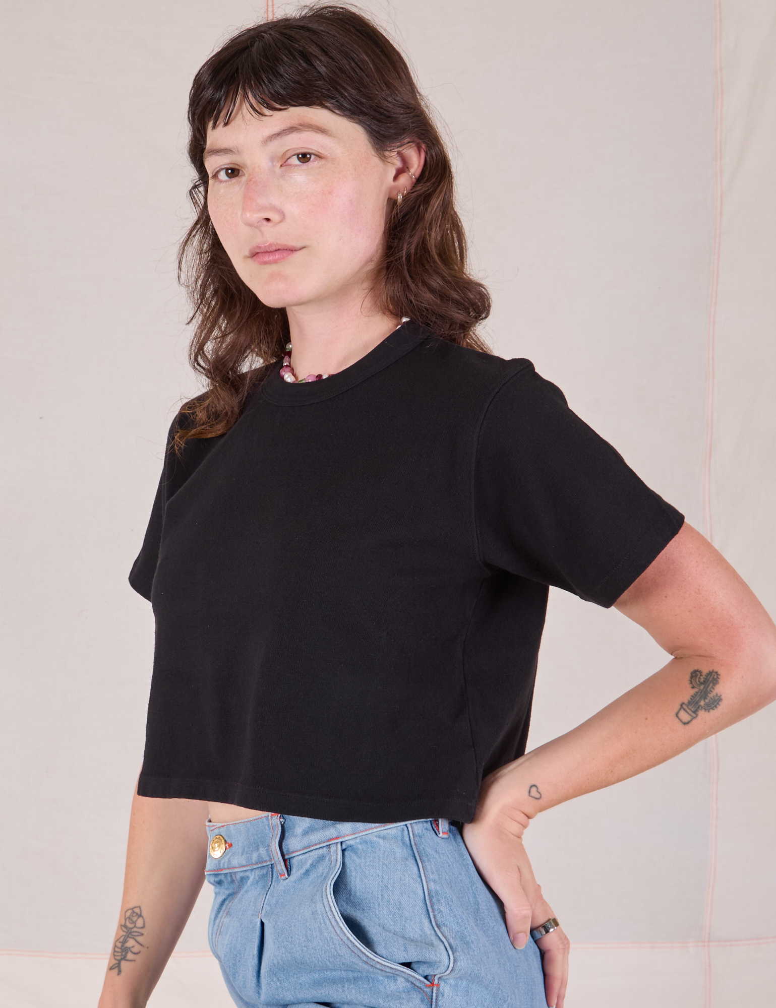 Cropped Burly Tee in Basic Black angled front view on Alex