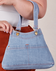 Light Wash Indigo Overall Handbags worn on arm of model