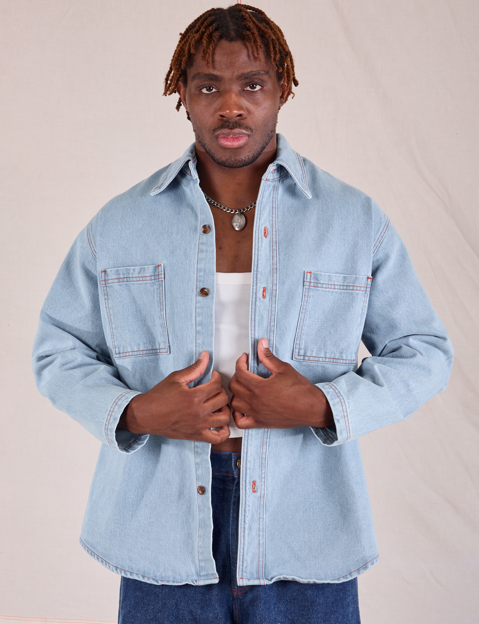 Issac is wearing Denim Overshirt in Light Wash