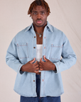 Issac is wearing Denim Overshirt in Light Wash